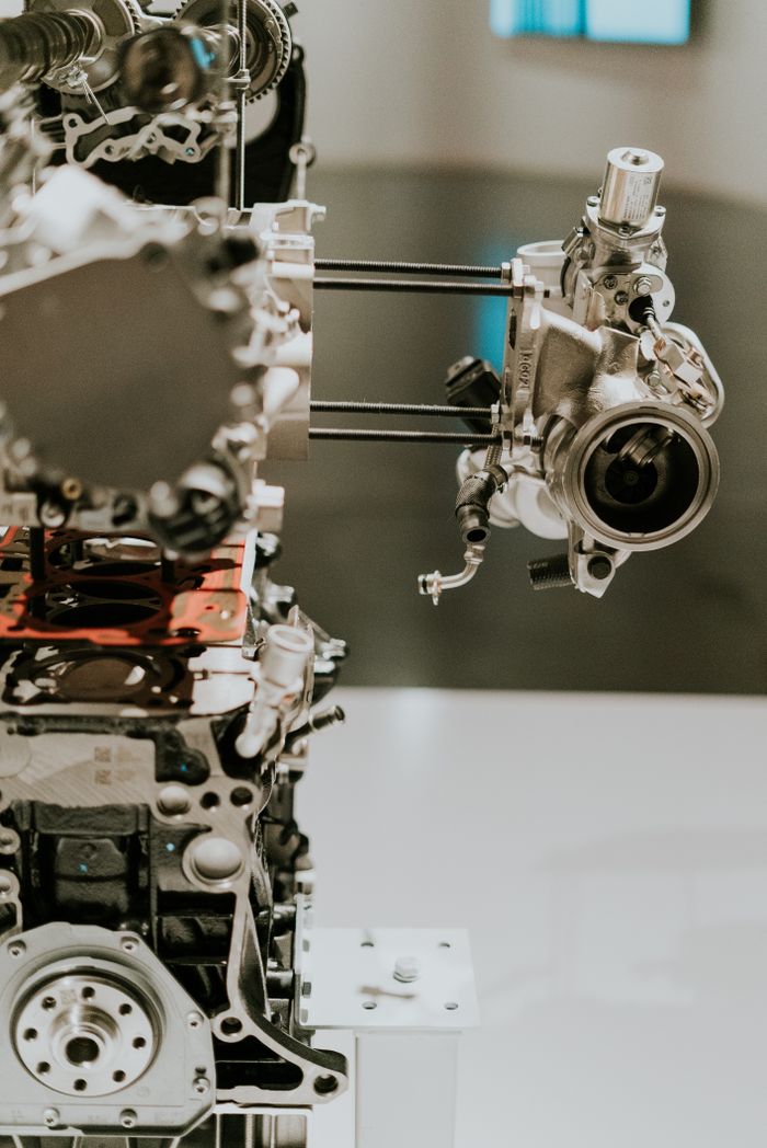 our-experience Detailed view of complex machinery parts showcasing engineering and mechanical design.