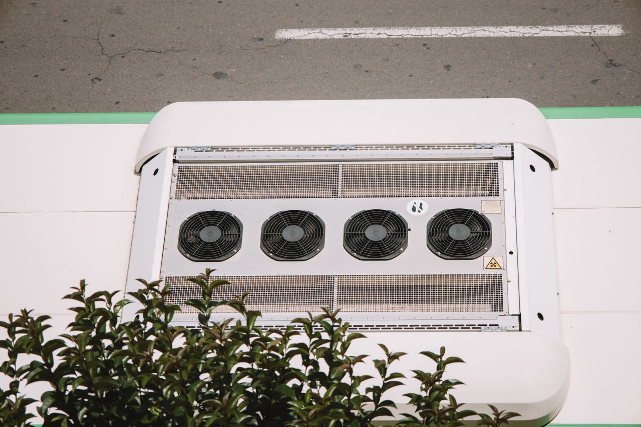 hero-img-01 Aerial shot of air conditioning unit with fans on an industrial rooftop in Valencia.