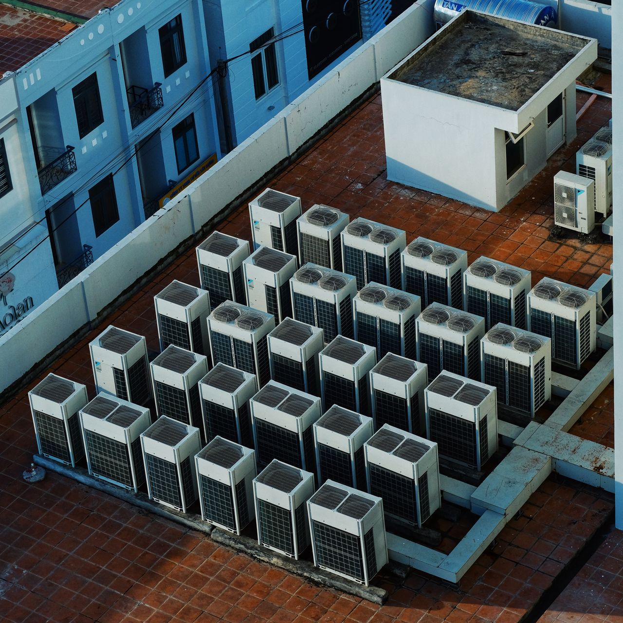 why-choose-us High angle view of rooftop HVAC units on a building in Buon Ma Thuot, Vietnam.