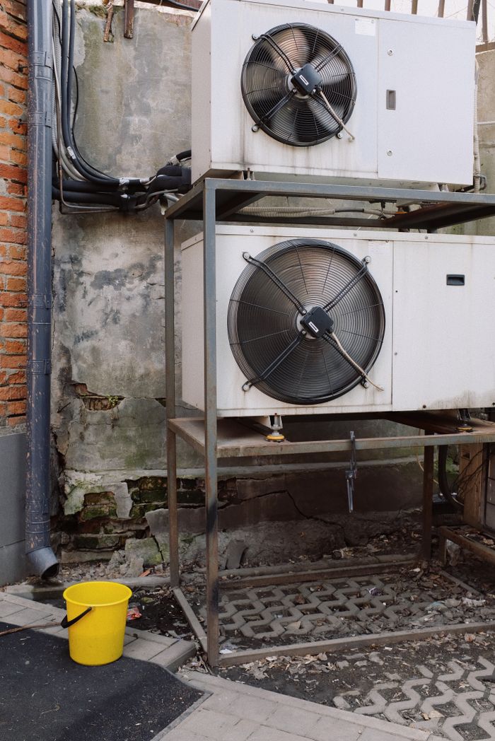 services-02 External units of air condition system installed on metal frame outside of building